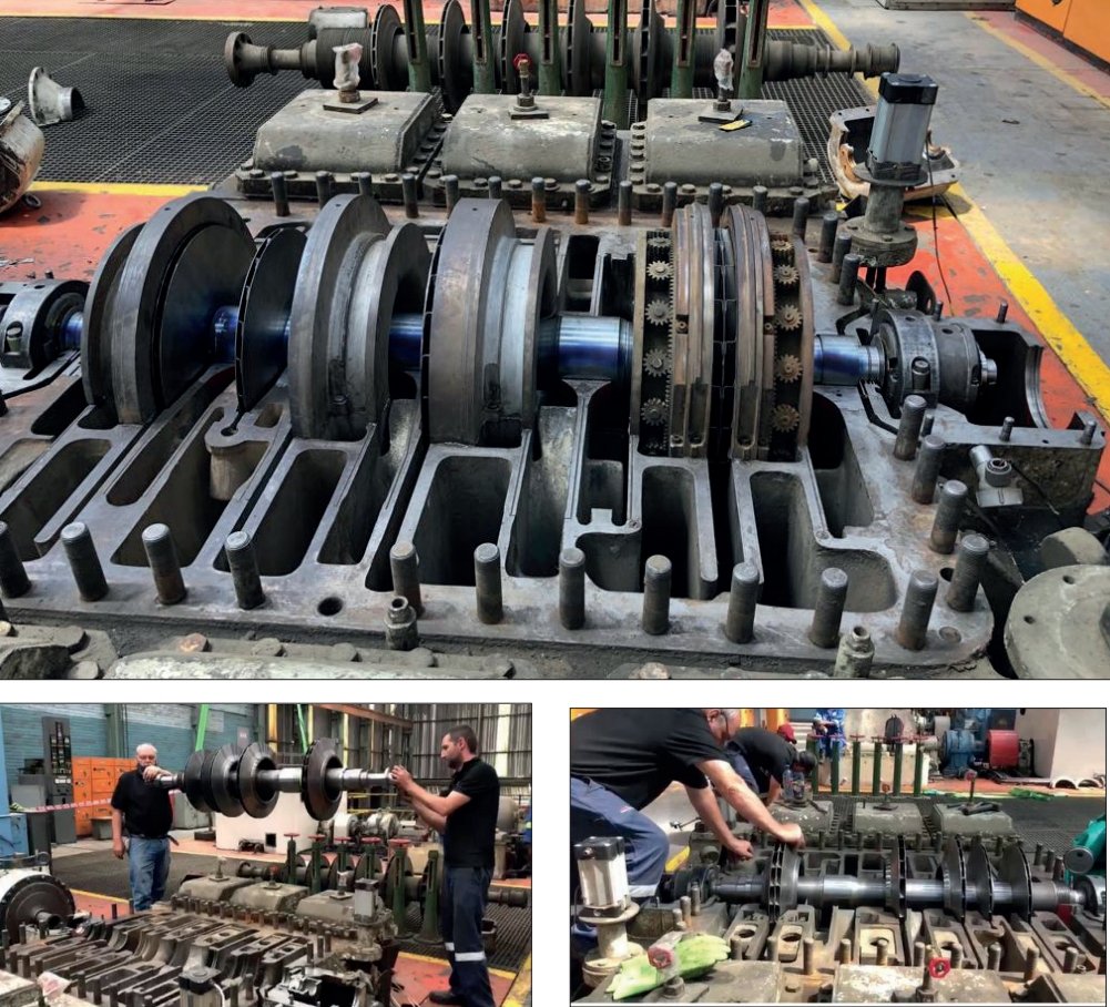 Technicians repairing heavy machinery engine components in the workshop